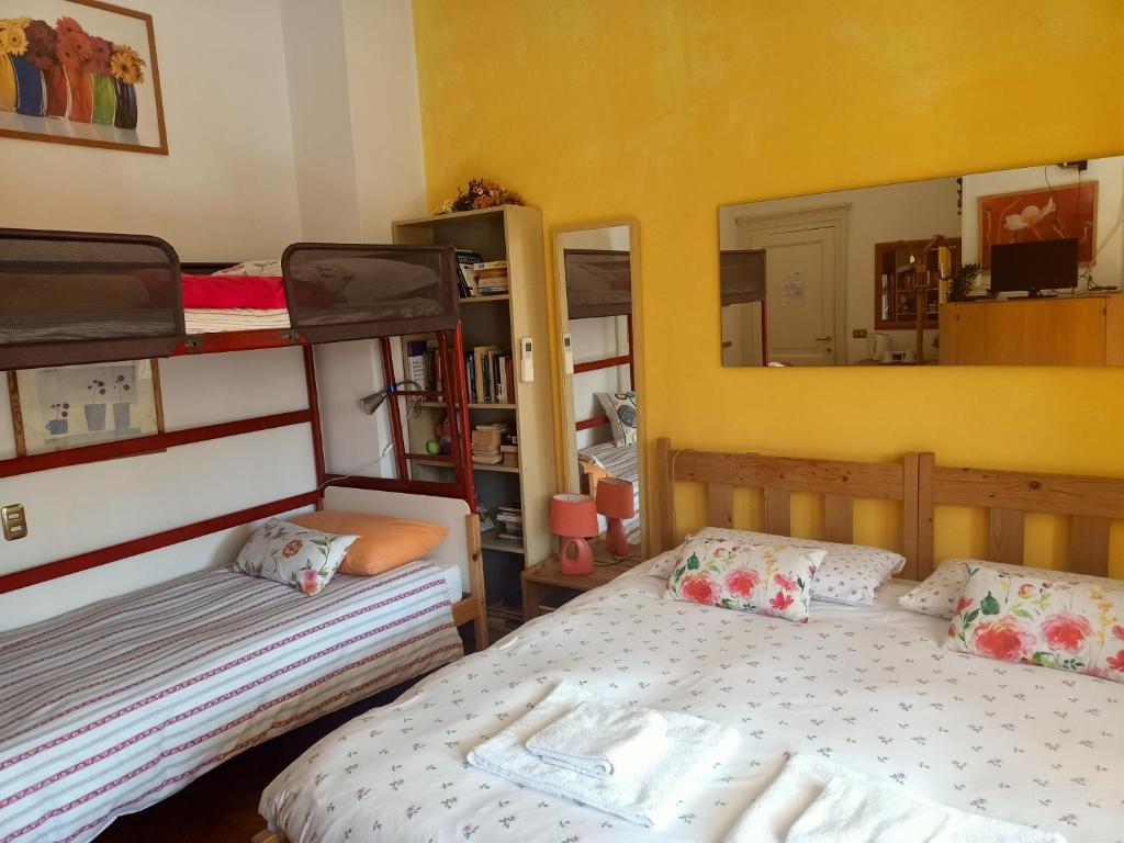 Postel nebo postele na pokoji v ubytování B&B Al Santo