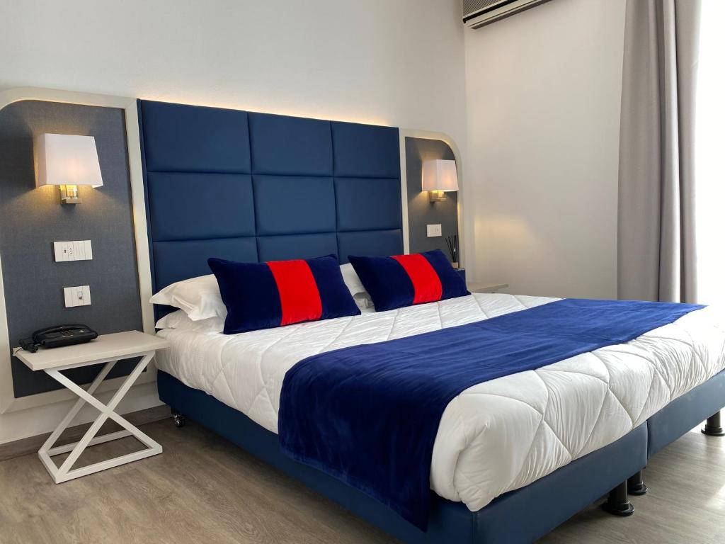 Postel nebo postele na pokoji v ubytování Hotel Rombino