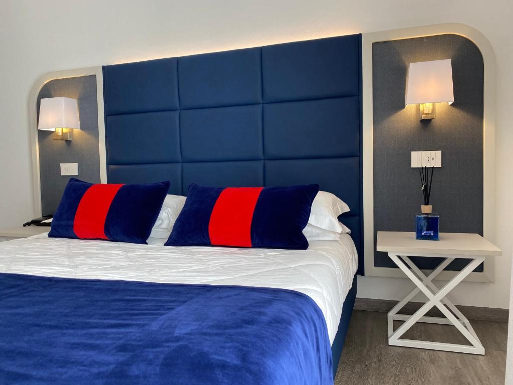 Postel nebo postele na pokoji v ubytování Hotel Rombino
