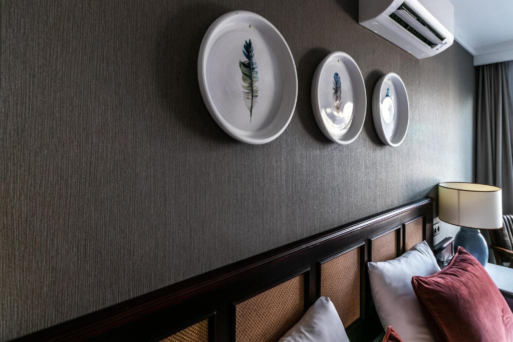 a hotel room with plates on the wall at Lara Park Hotel in Antalya