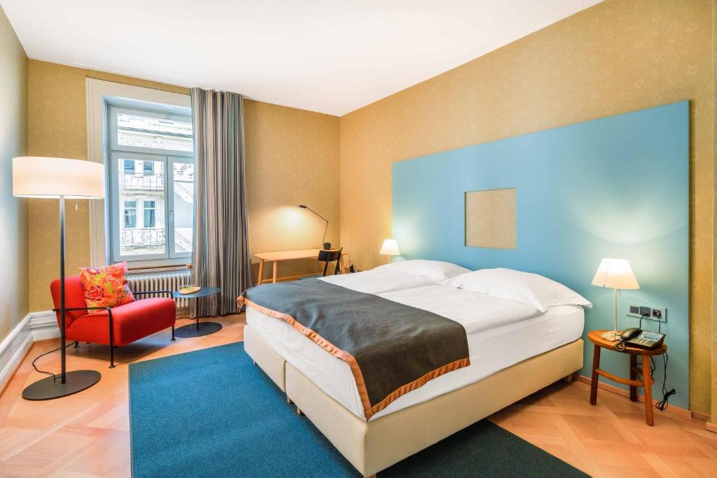 Postel nebo postele na pokoji v ubytování Alma Hotel