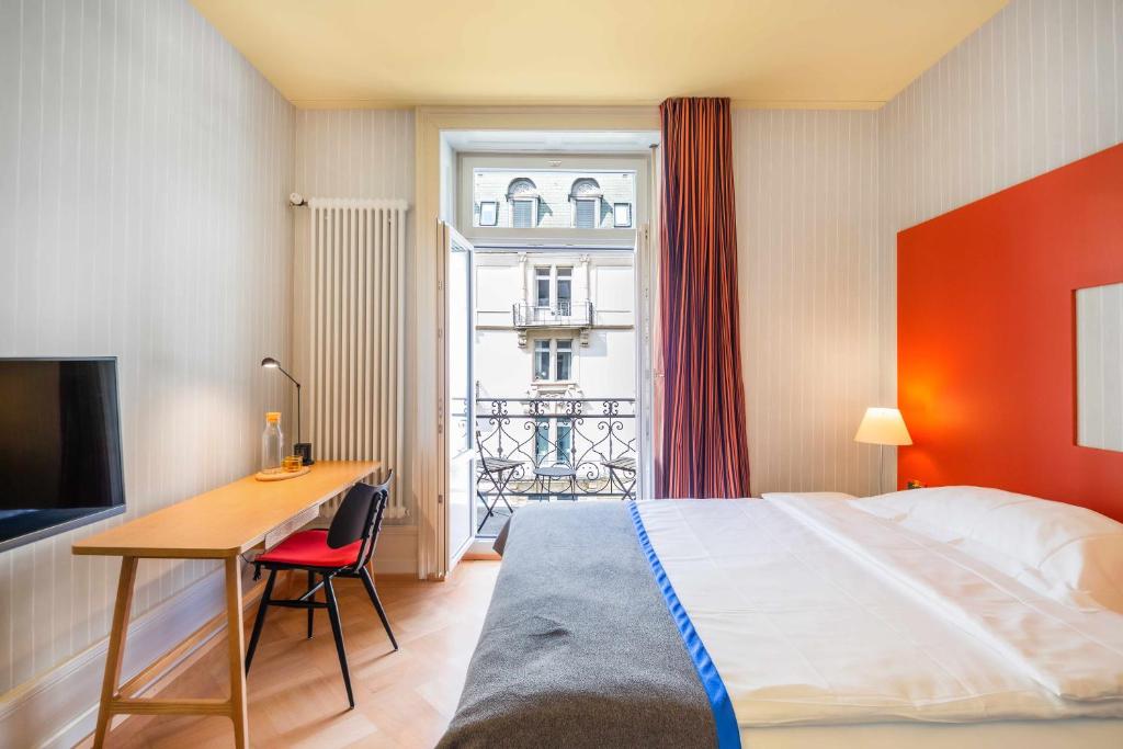 Postel nebo postele na pokoji v ubytování Alma Hotel