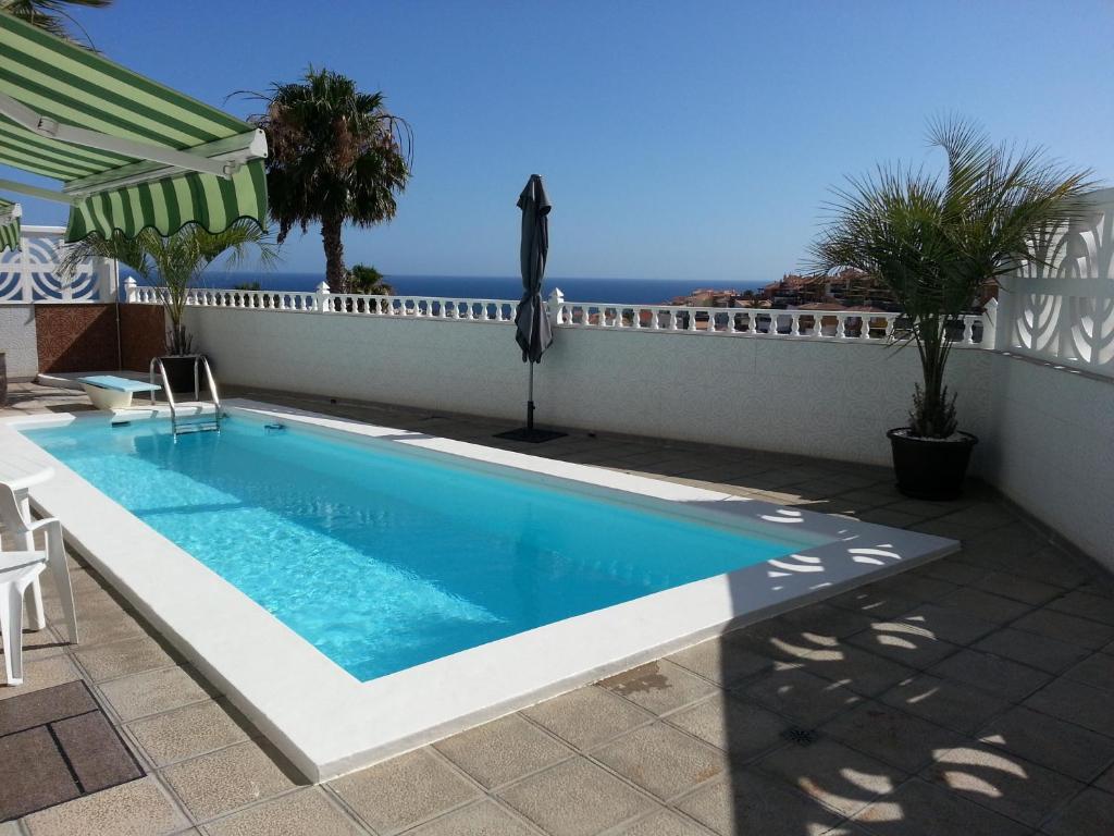 a swimming pool with a view of the ocean at Loma Dos, Arguineguin in La Playa de Arguineguín