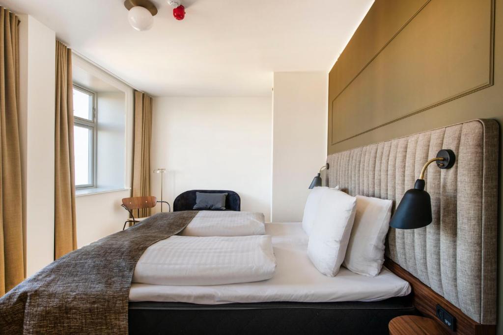 Postel nebo postele na pokoji v ubytování Hotel Sct. Thomas