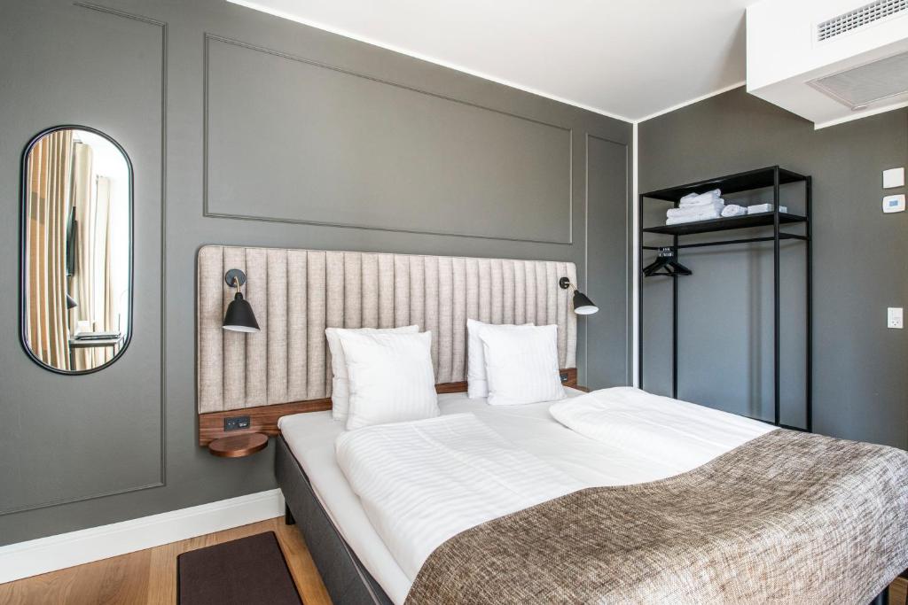 Postel nebo postele na pokoji v ubytování Hotel Sct. Thomas