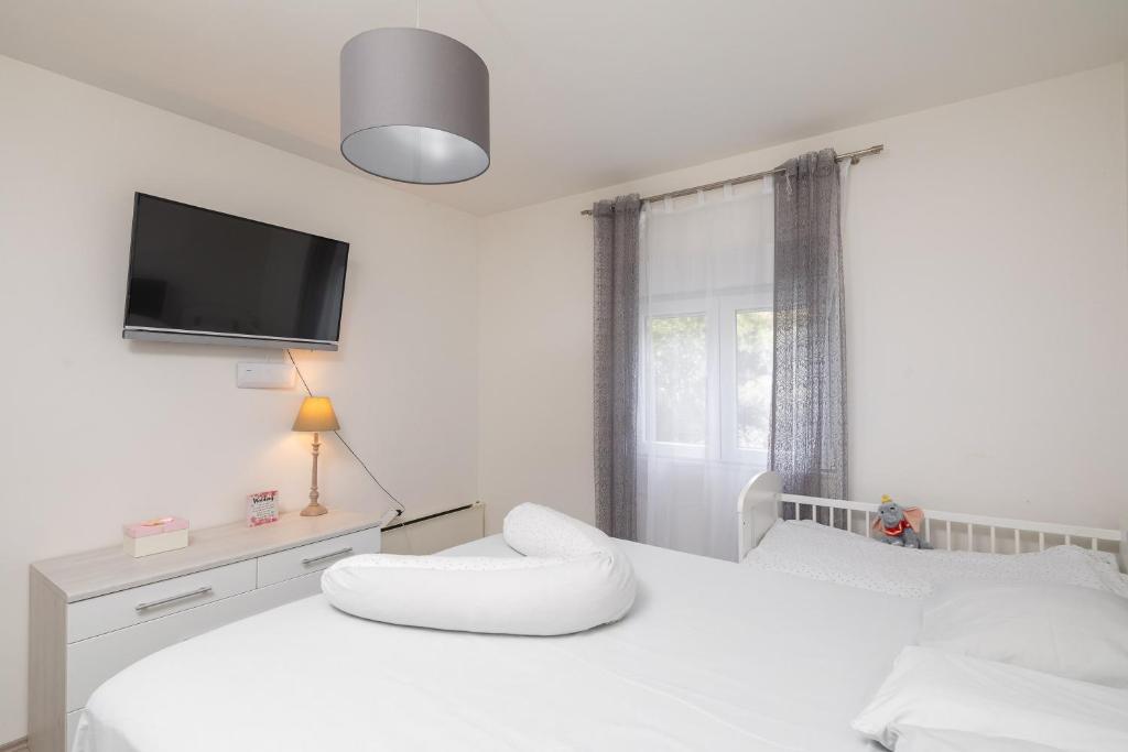 Posteľ alebo postele v izbe v ubytovaní Apartments Sunshine Rays