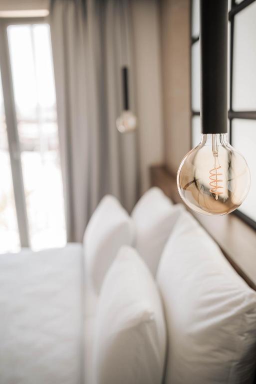 Postel nebo postele na pokoji v ubytování Hotel Carpe Diem