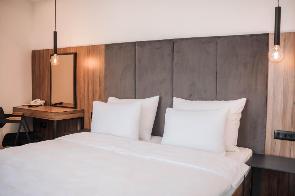 Postel nebo postele na pokoji v ubytování Hotel Carpe Diem