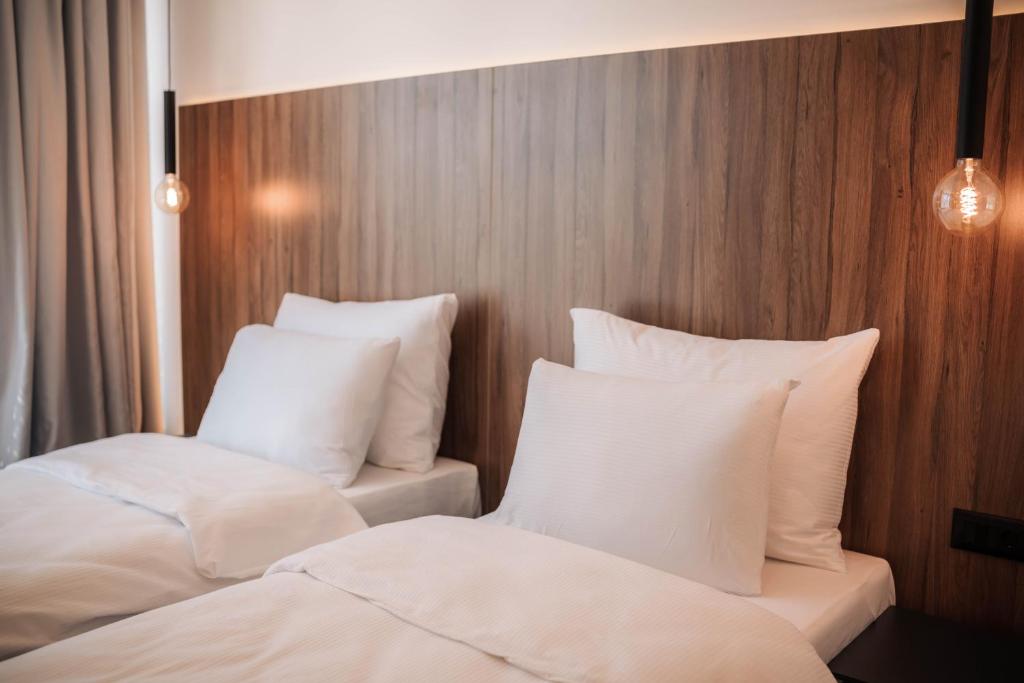 Postel nebo postele na pokoji v ubytování Hotel Carpe Diem