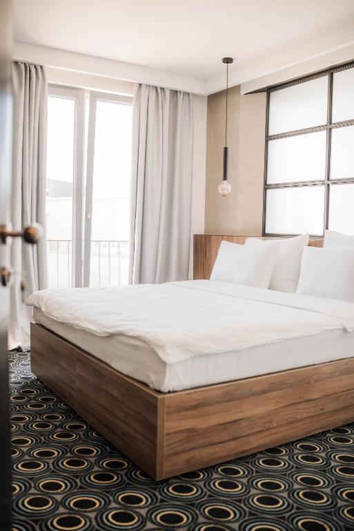 Postel nebo postele na pokoji v ubytování Hotel Carpe Diem