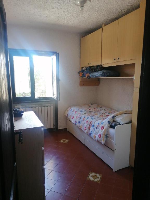 A bed or beds in a room at Residence La baita