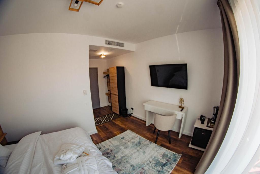 TV a/nebo společenská místnost v ubytování Hotel B4