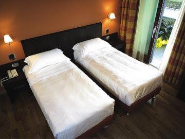 Postel nebo postele na pokoji v ubytování Hotel Dei Vicari