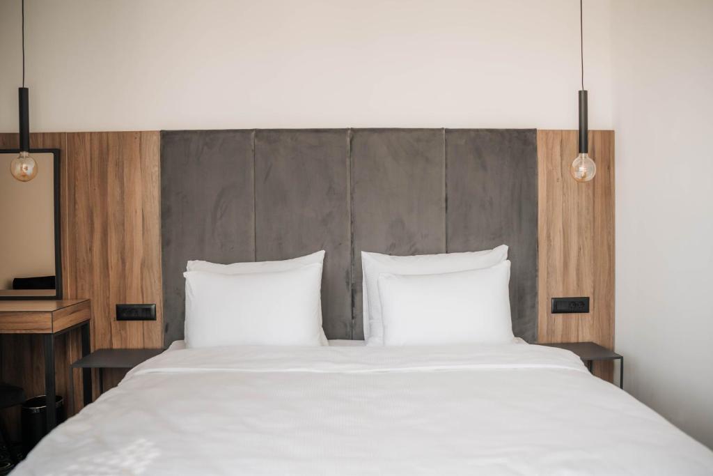 Postel nebo postele na pokoji v ubytování Hotel Carpe Diem