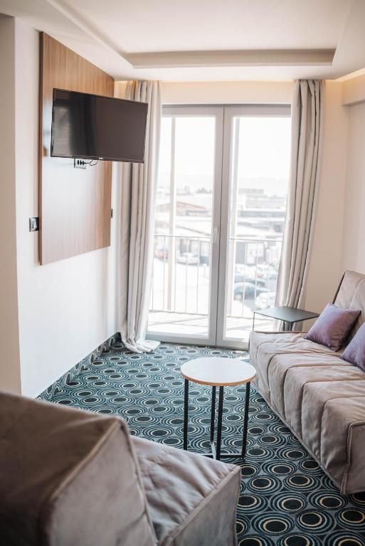 TV a/nebo společenská místnost v ubytování Hotel Carpe Diem