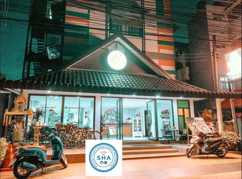 a scooter parked in front of a building at Rinn Boutique House in Chiang Mai