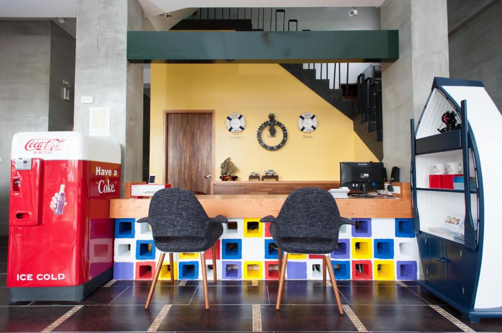 a lego restaurant with two chairs and a counter at Discovery B&amp;B in Linbian