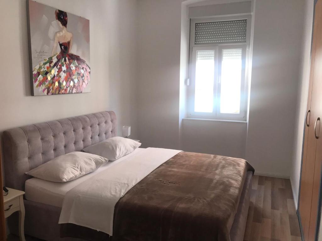 Posteľ alebo postele v izbe v ubytovaní City Core Apartment