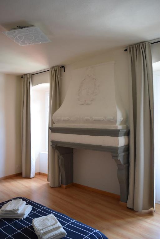 Łóżko lub łóżka w pokoju w obiekcie residenza la roggia