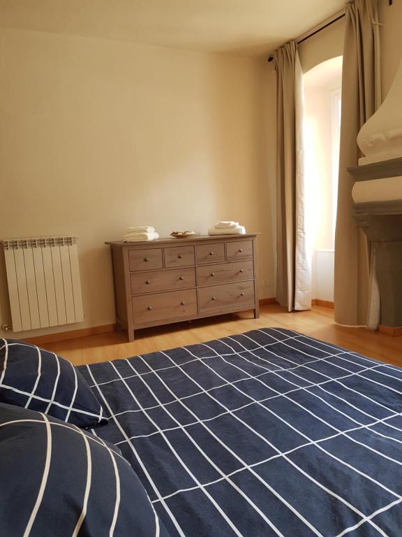 Łóżko lub łóżka w pokoju w obiekcie residenza la roggia