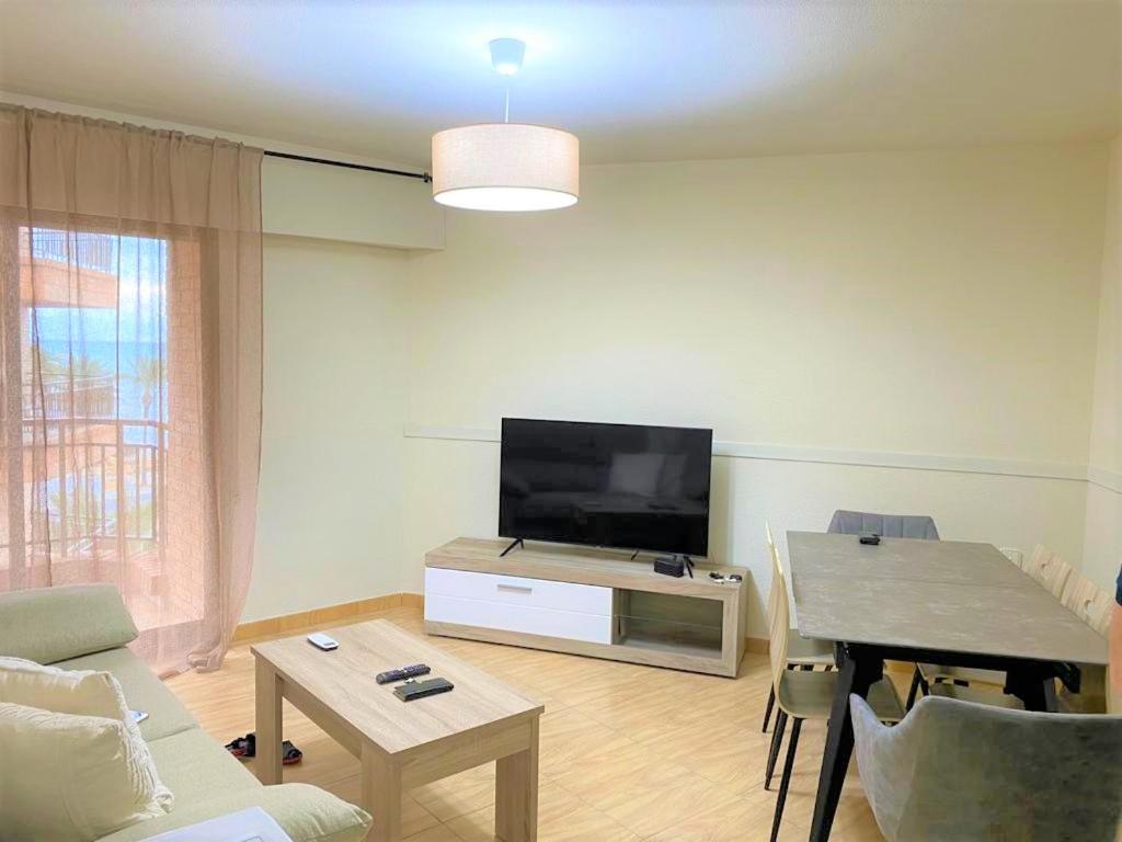 A television and/or entertainment centre at Marinasunbeach Paseo Maritimo