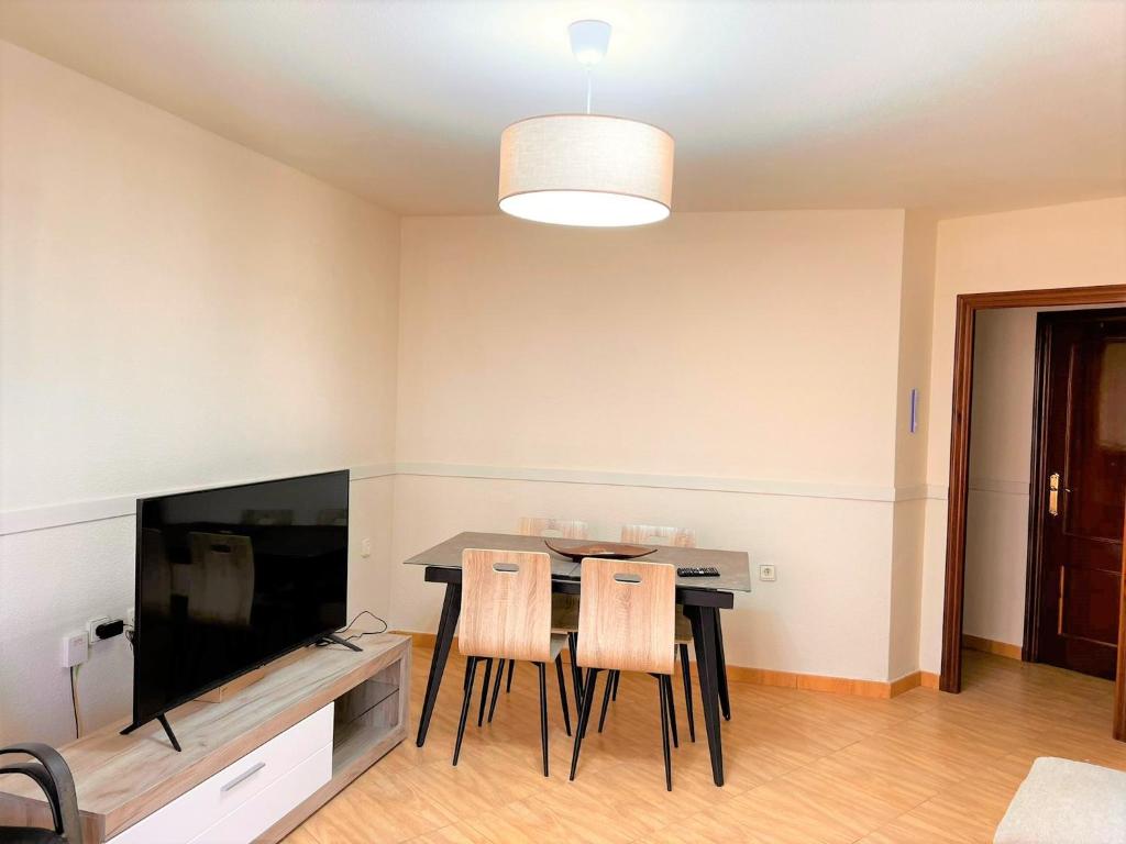 A television and/or entertainment centre at Marinasunbeach Paseo Maritimo