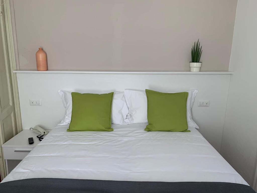 Postel nebo postele na pokoji v ubytování Hotel Loveno