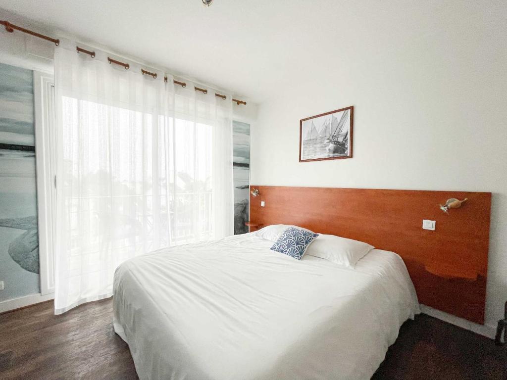 Postel nebo postele na pokoji v ubytování Hotel les Alignements