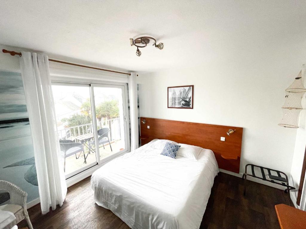 Postel nebo postele na pokoji v ubytování Hotel les Alignements
