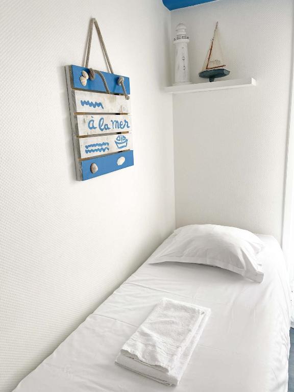 Postel nebo postele na pokoji v ubytování Hotel les Alignements