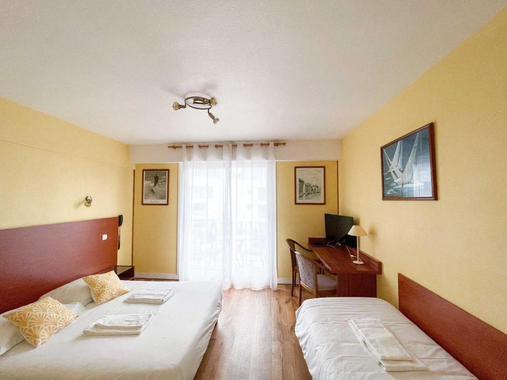Postel nebo postele na pokoji v ubytování Hotel les Alignements