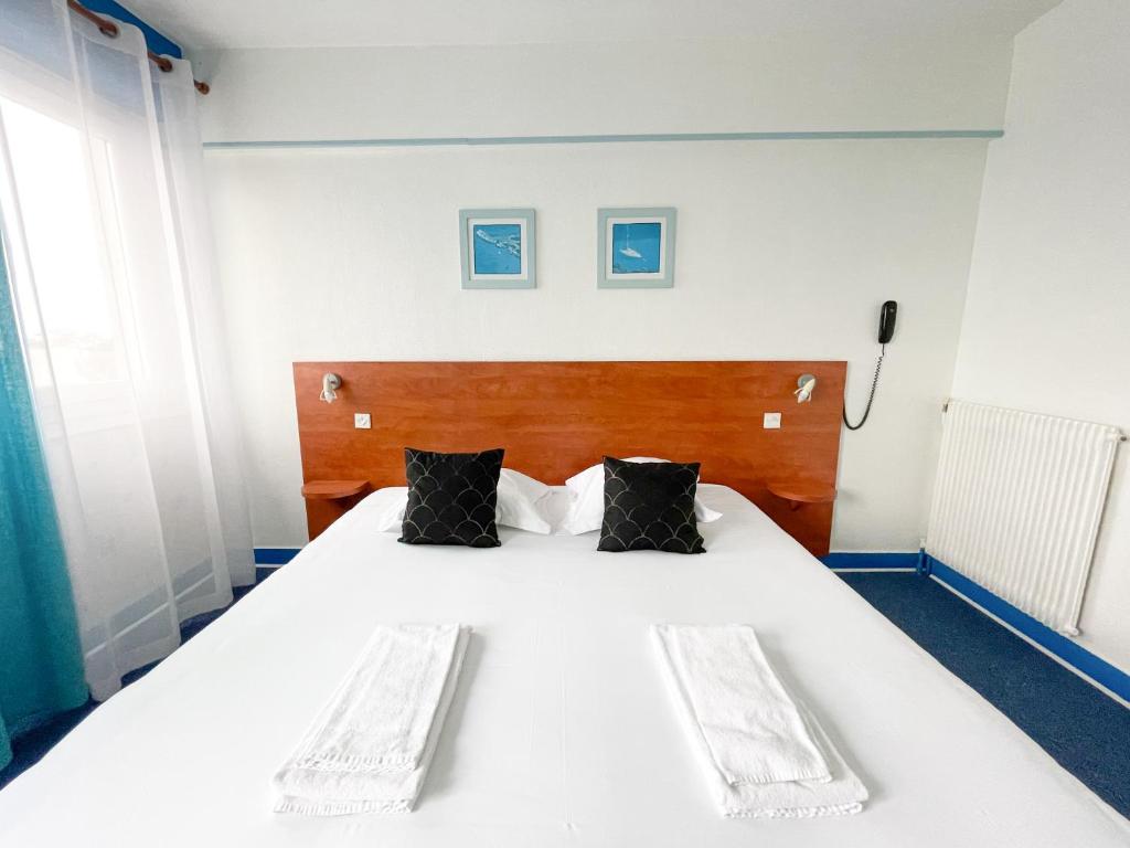 Postel nebo postele na pokoji v ubytování Hotel les Alignements