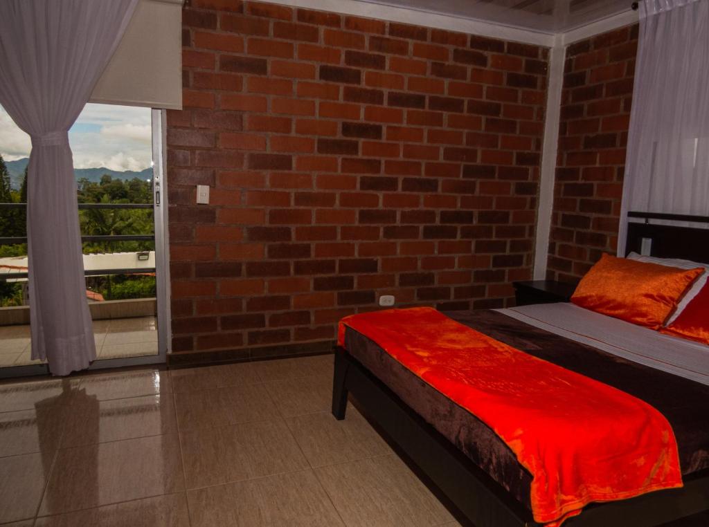 Postel nebo postele na pokoji v ubytování Hotel Campestre Sueño del Abuelo