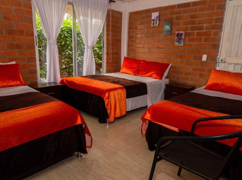 Postel nebo postele na pokoji v ubytování Hotel Campestre Sueño del Abuelo