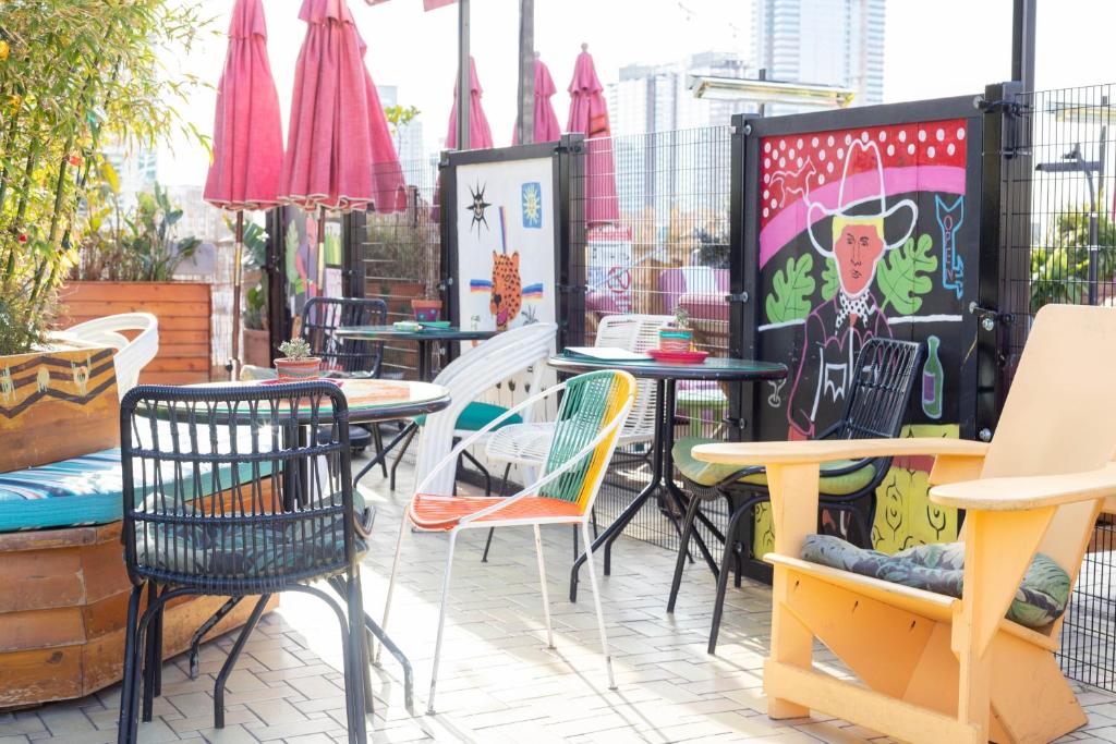 a group of tables and chairs on a patio at Freehand Los Angeles in Los Angeles