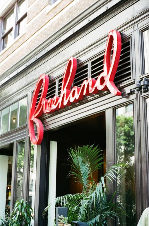 a red sign on the front of a restaurant at Freehand Los Angeles in Los Angeles