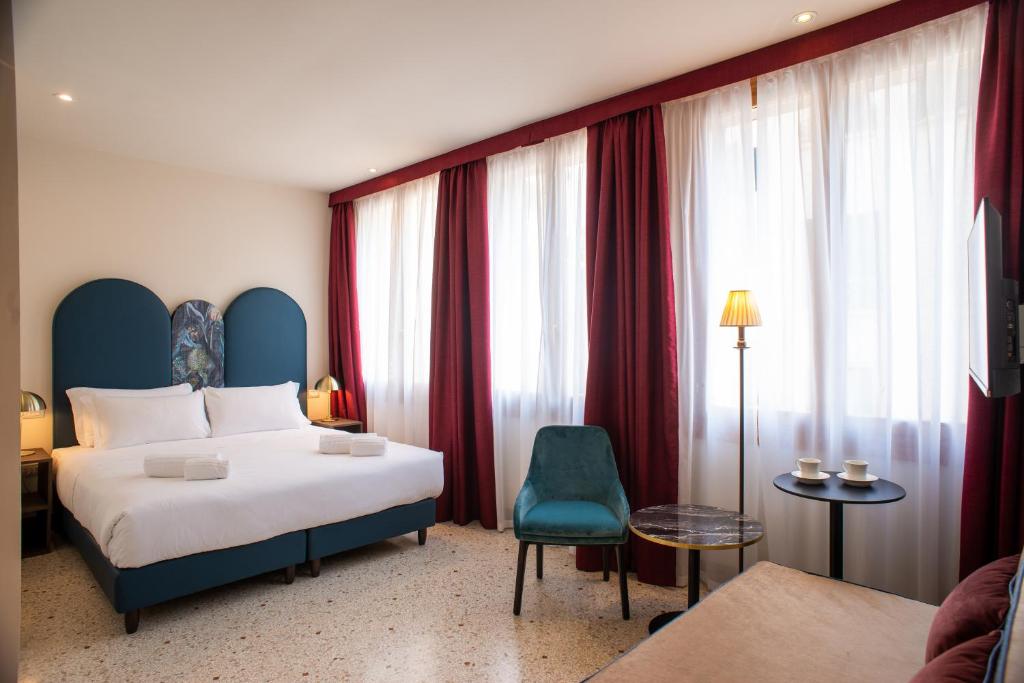 Postel nebo postele na pokoji v ubytování Palazzina Fortuny