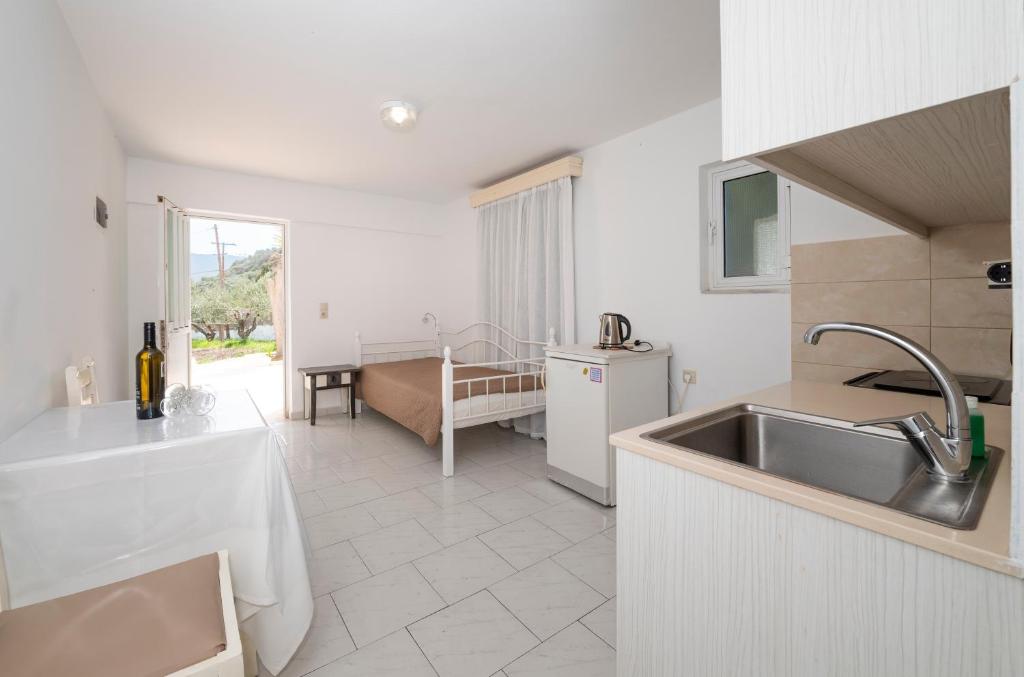 a kitchen with a sink and a counter top at Villa Giorgos in Kefalos