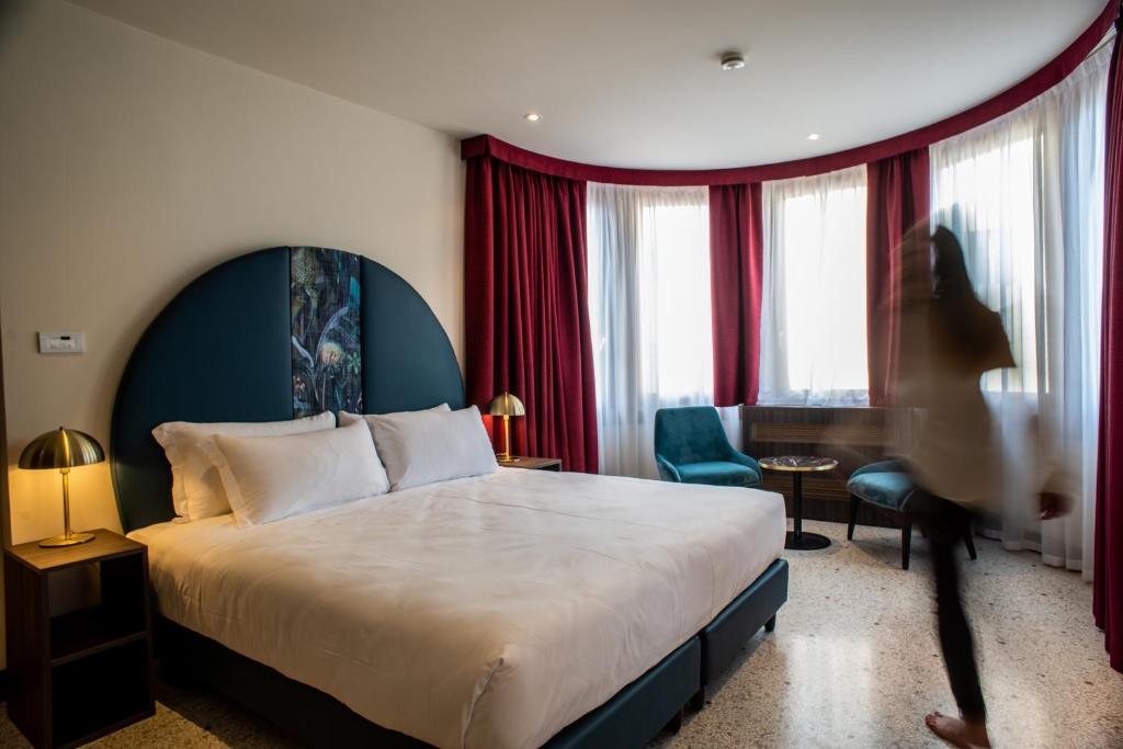 Postel nebo postele na pokoji v ubytování Palazzina Fortuny