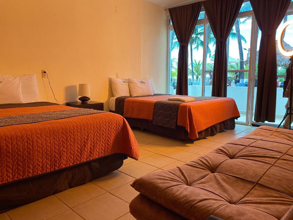 Postel nebo postele na pokoji v ubytování Hotel Villa Murano