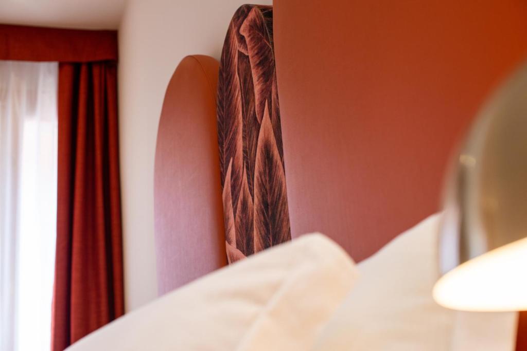 Postel nebo postele na pokoji v ubytování Palazzina Fortuny