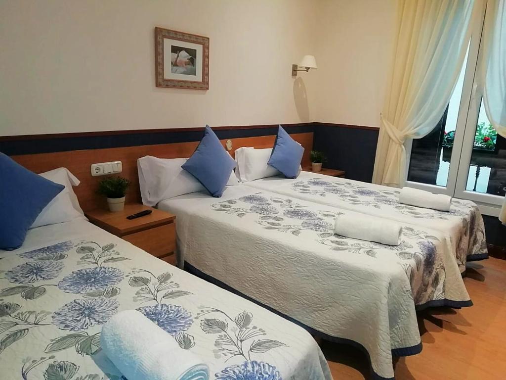 Cama o camas de una habitación en Pensión San Jerónimo