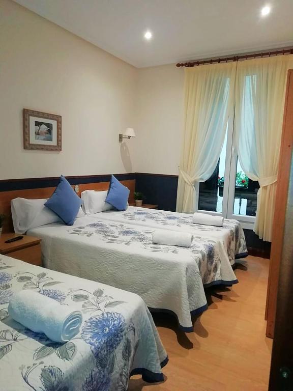 Cama o camas de una habitación en Pensión San Jerónimo