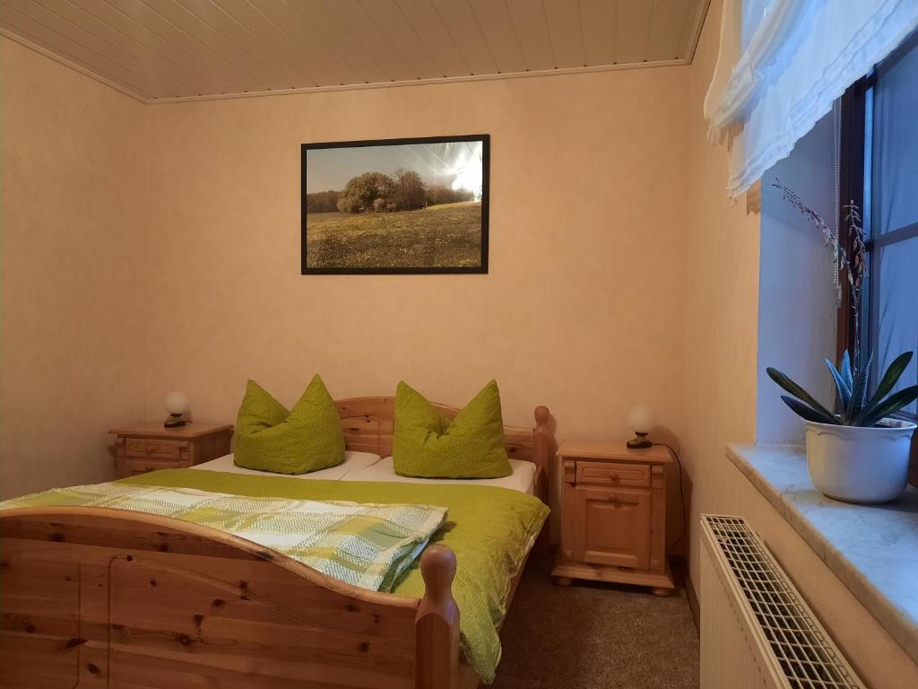 Postel nebo postele na pokoji v ubytování Das kleine, gemütliche Ferienhaus