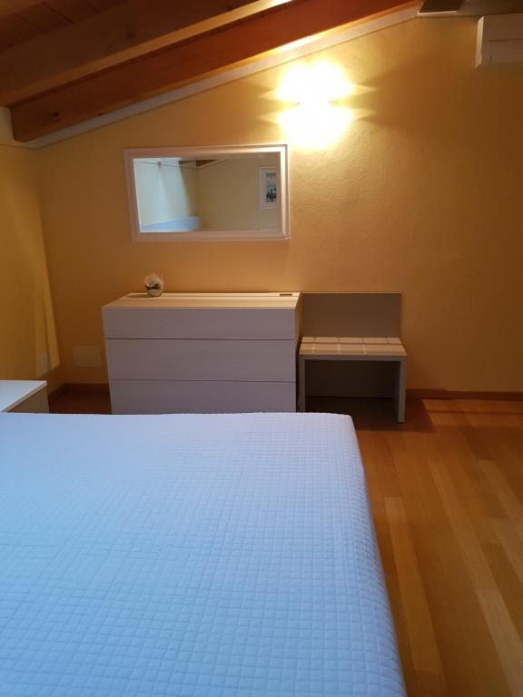 Łóżko lub łóżka w pokoju w obiekcie Casa Amalia