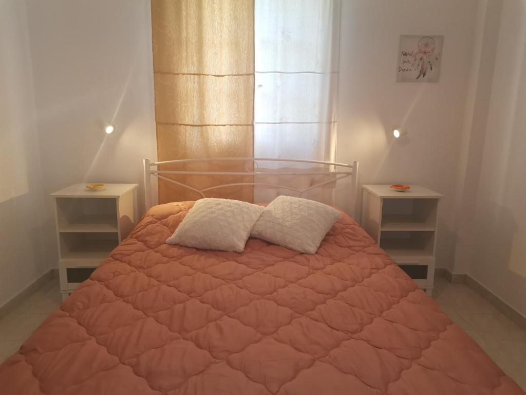 Postel nebo postele na pokoji v ubytování Sausan Apartments