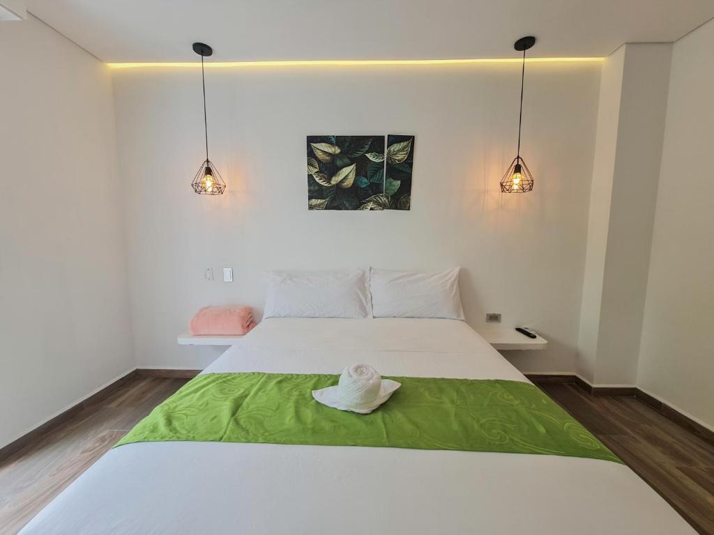 Postel nebo postele na pokoji v ubytování Hotel Monte Bello