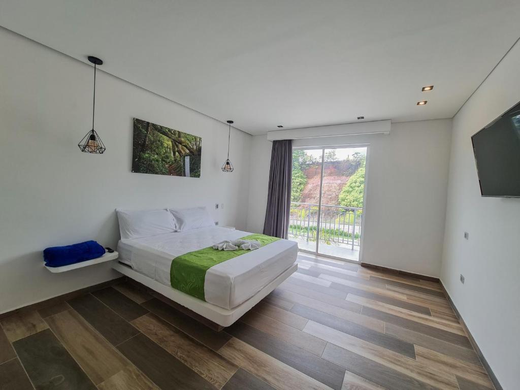 Postel nebo postele na pokoji v ubytování Hotel Monte Bello