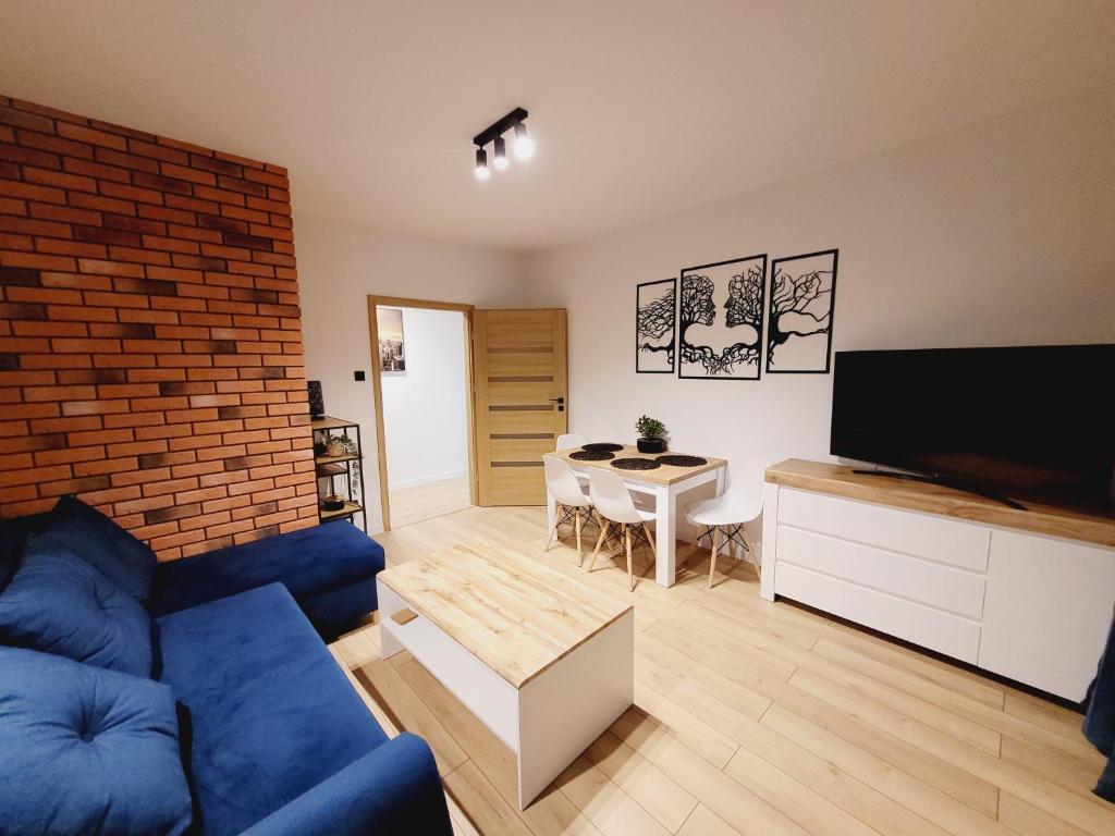 Televízia a/alebo spoločenská miestnosť v ubytovaní Apartament Morski Brzeg Gdynia Centrum