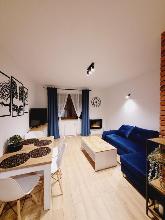 Televízia a/alebo spoločenská miestnosť v ubytovaní Apartament Morski Brzeg Gdynia Centrum
